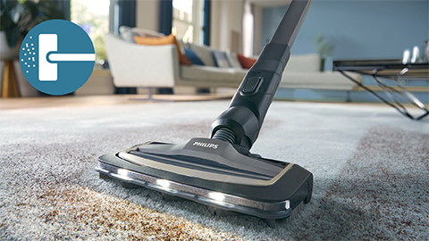 Philips&nbsp;AquaTrio 9000.&nbsp;sērijas sausās un mitrās uzkop&scaron;anas bezvadu putekļsūcējs uzkopj paklāju un grīdsegu.